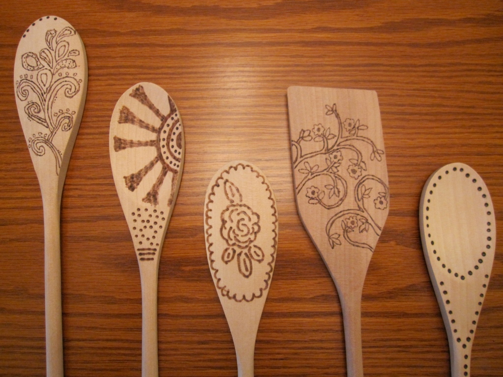 Burned Wooden Spoons With Scissors and a Spatula